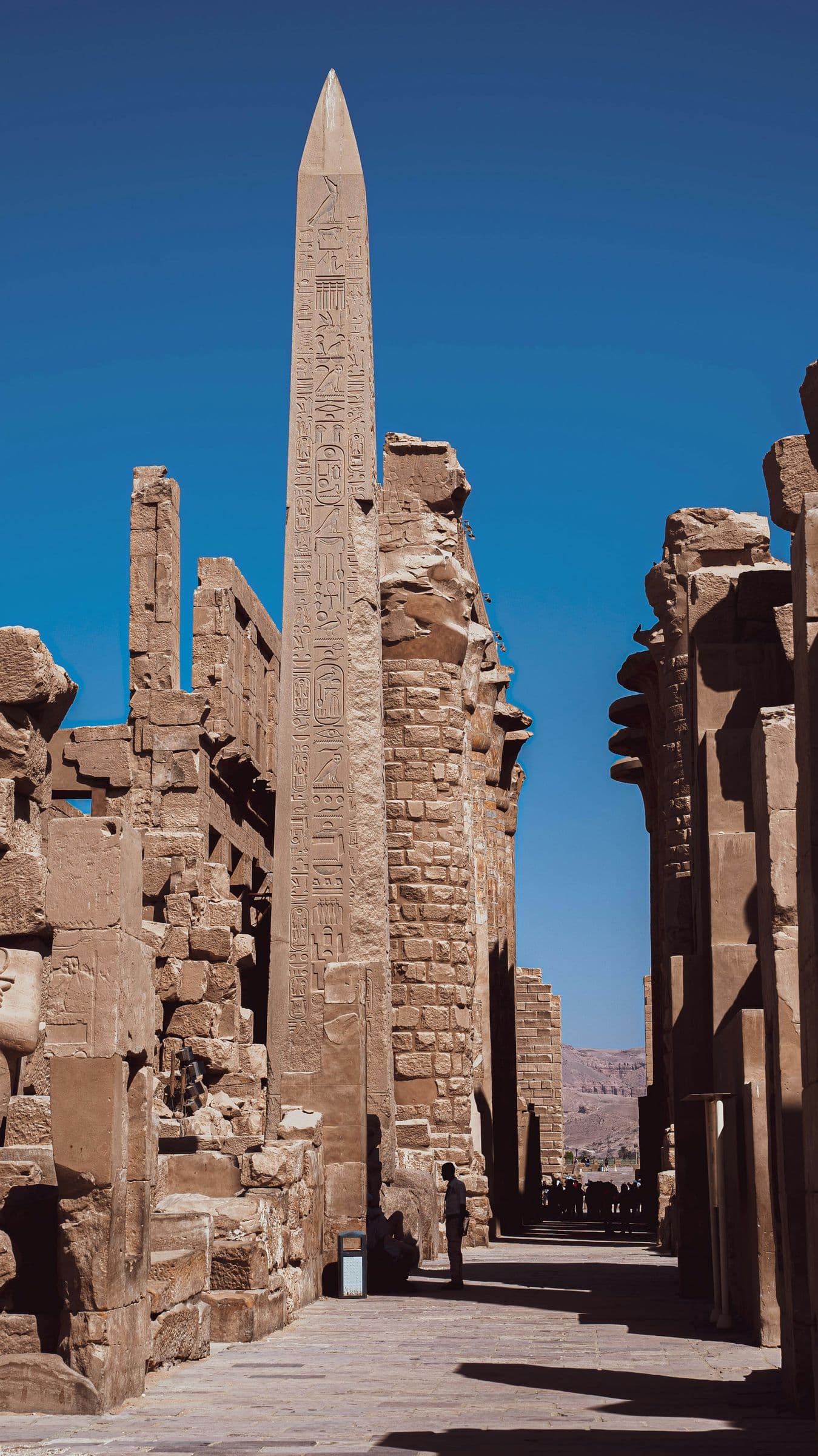 An obelisk rising above the ruins of Karnak Temple