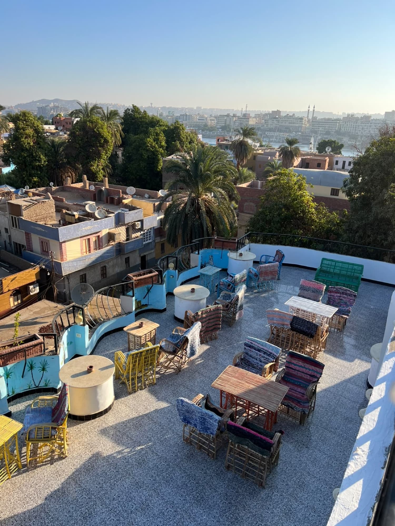 Looking down on the rooftop terrace with its colourful Nubian seating