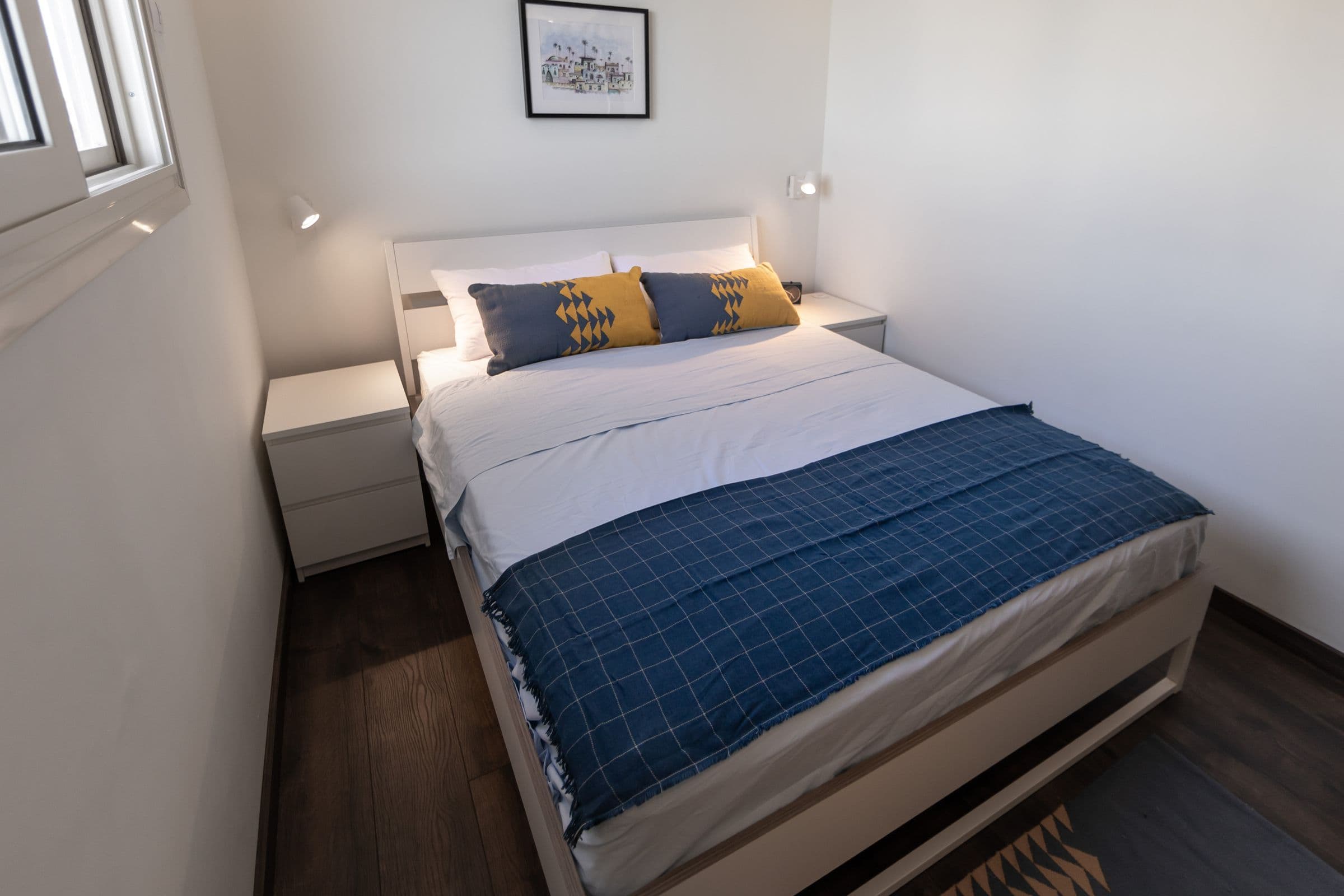 A calm double bedroom aboard Anakob